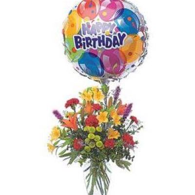 Take their birthday to brand new heights with this colorful arrangement of flowers and a high-flying birthday balloon.
Alstroemeria, carnations, chrysanthemums and lilies are delivered in a clear glass vase with attached foil balloon.