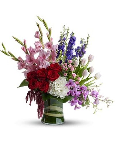 Your love burns eternally - show them your heart with this elegant bouquet. The Endless Love arrangement is a modern blend of roses, mini hydrangea, green trick dianthus and hypericum berries. Loops of lily grass create a heart to show your true sentiments. This luxurious bouquet is sure to make a lasting impression on your forever love.