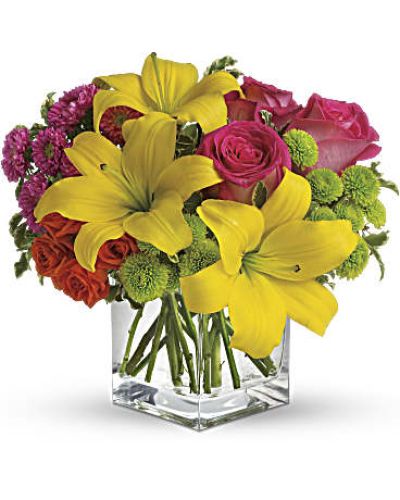 <p>Splash into spring! Sun-bright yellow, hot pink and orange blooms add up to a sensational and oh-so-stylish spring & summer floral arrangement for any occasion.<br />
Hot pink and orange roses are mixed with yellow asiatic lilies, hot pink matsumoto asters and lime green button spray chrysanthemums in a clear glass cube vase.</p>