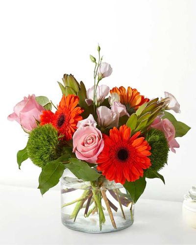 Home is where the heart is, especially when you fill it with these roses and gerbera daisies.