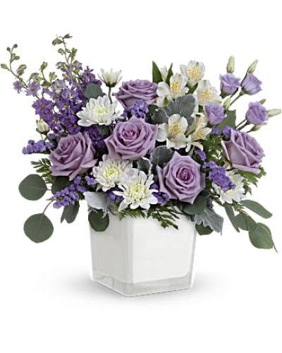 <div id="mark-3" class="m-pdp-tabs-marketing-description">Loveliest lavender! Make any day feel extra special with the soft purple hues of this luxurious rose bouquet, presented in a soft white glass cube.</div>
<p>&nbsp;</p>
<div id="desc-3">Lavender roses, white alstroemeria, lavender lisianthus, lavender larkspur, white cushion spray chrysanthemums and lavender sinuata statice are arranged with dusty miller, leatherleaf fern and silver dollar eucalyptus.</div>