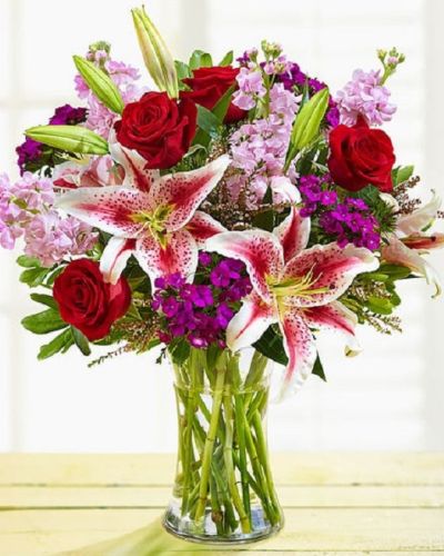 <p>Enjoy this exquisite combination of red and purple bloom guaranteed to make your recipient equally dazzled with the unparalleled beauty of this arrangement. Whether it's for a special occasion or just because, it's a gift that you'll be glad you sent.</p>