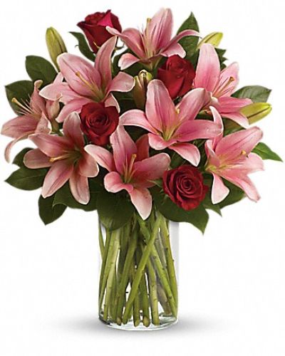 <div class="m-pdp-tabs-description">
<div id="mark-1" class="m-pdp-tabs-marketing-description">Turn an ordinary day into an enchanting daydream by sending her this magical bouquet! This stunning bouquet of rich red roses and magnificent pink lilies pampers her senses, refreshes her spirit and shows her how much you really care.</div>
</div>
<p id="arrngDescp">Includes red roses, pink lilies and fresh lemon leaves.</p>