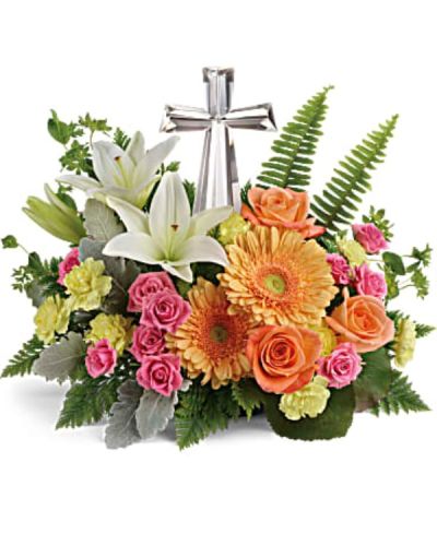 <div id="mark-3" class="m-pdp-tabs-marketing-description">A radiant celebration of faith, this bright bouquet of cheerful orange and pink blooms surrounds a reverent crystal cross keepsake. A precious addition to any special occasion.</div>
<p>&nbsp;</p>
<div id="desc-3">
<ul>
<li>Pink spray roses, white asiatic lilies, light orange gerberas, and yellow miniature carnations are accented with bupleurum, dusty miller, galax leaves, sword fern, and leatherleaf fern.</li>
</ul>
</div>