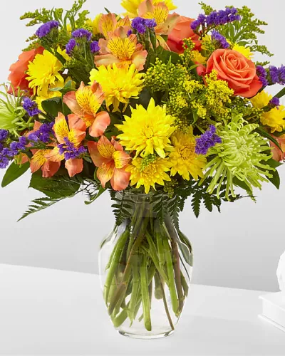 Flowers of yellow and green, and pops of orange and purple. Full of color and texture, all you need is love and our Marmalade Skies Bouquet.